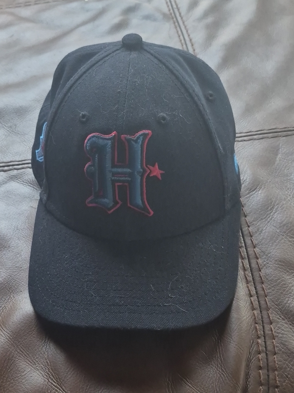 New Era Black Hat with Blue and Red Houston 'H' Logo